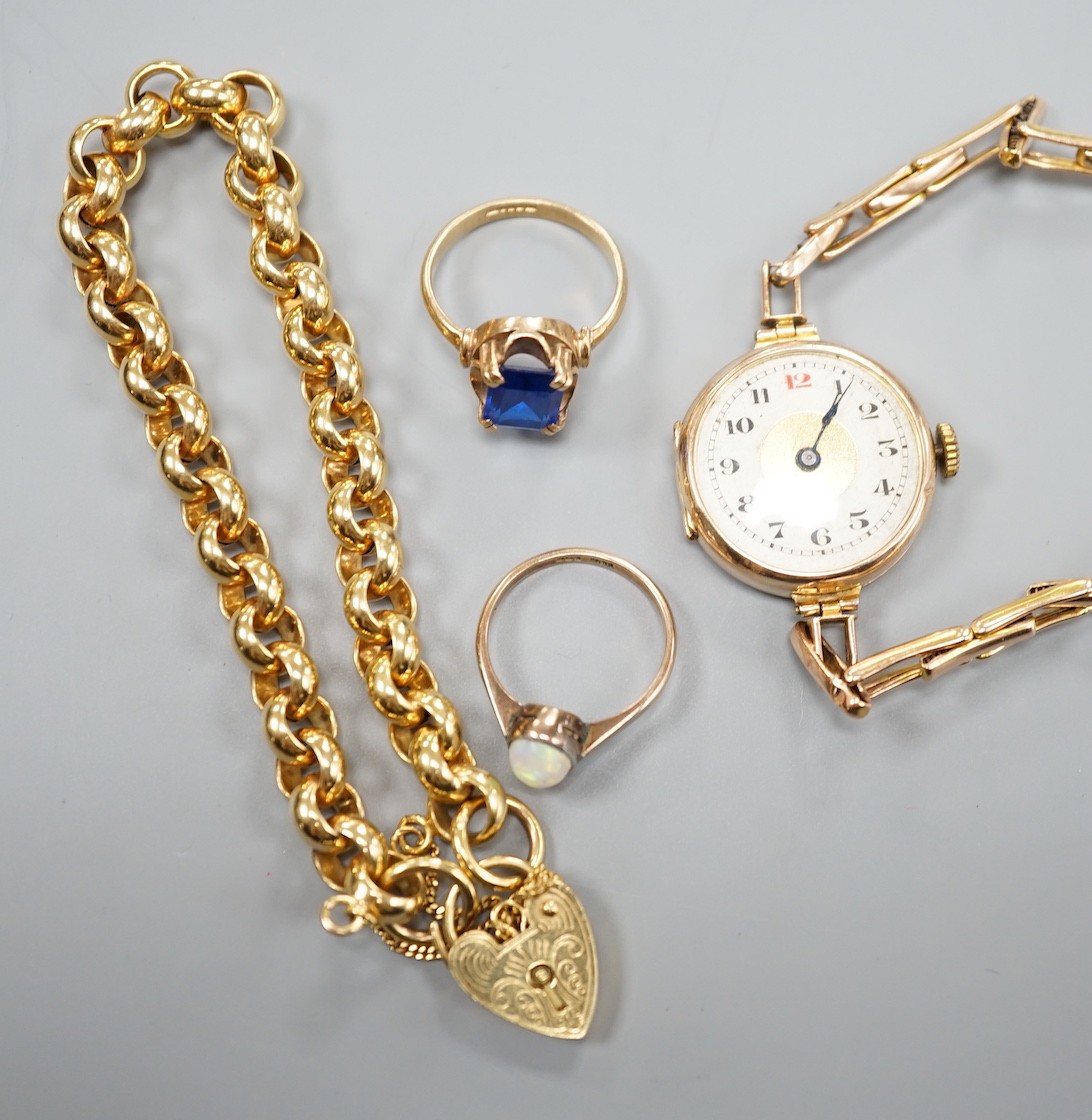 A modern 9ct gold bracelet, 18cm, 11.9 grams, two 9ct rings an a lady's 9ct gold manual wind wrist watch, on a 9ct bracelet, gross 20.7 grams.